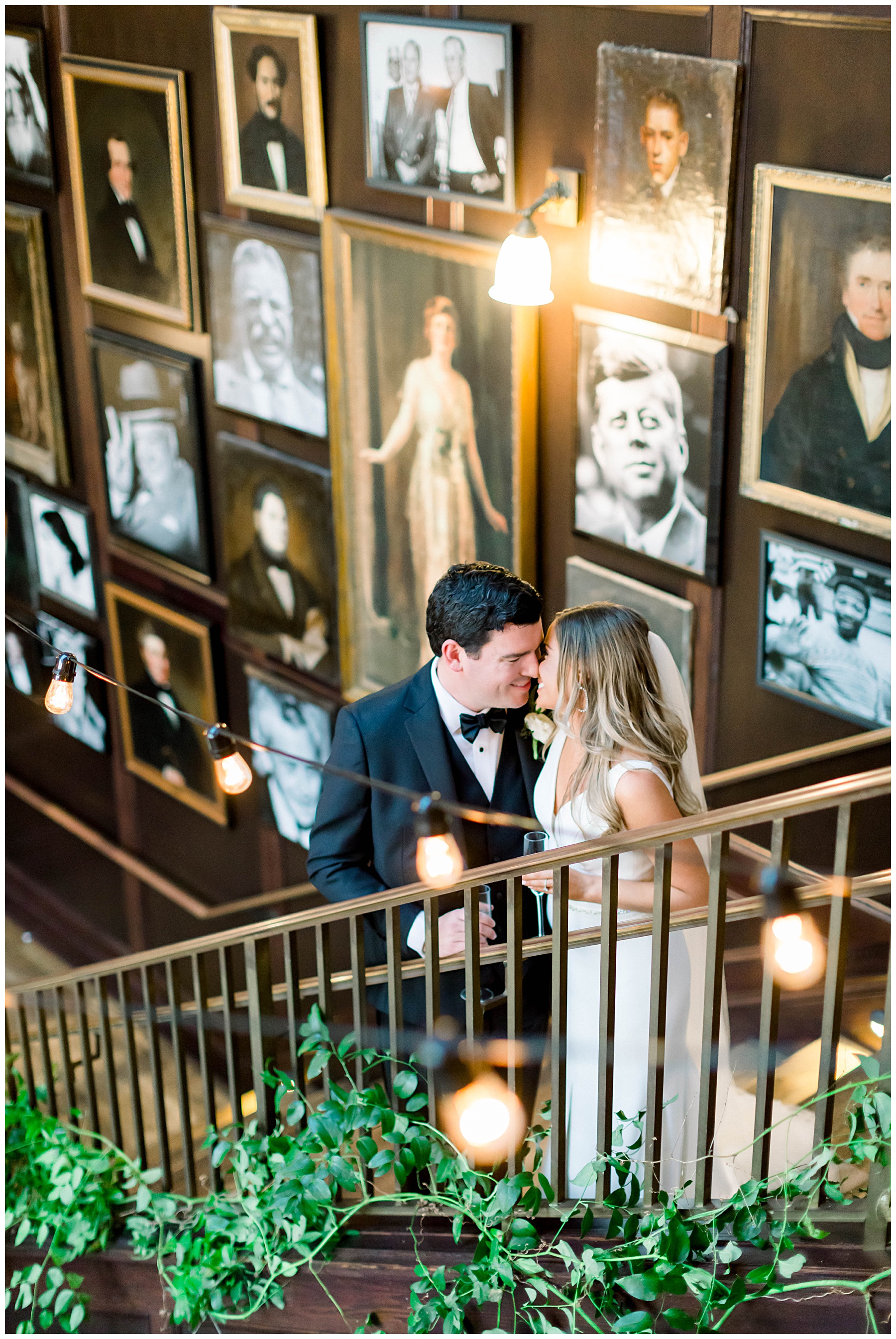 Bride and groom kissing on the stairs of Oxford Exchange.